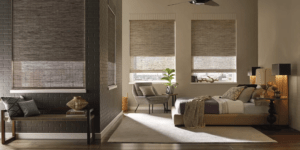 home with bed in the corner and curtains to keep the cold out hanging from the windows
